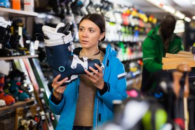 Woman choosing ski boots