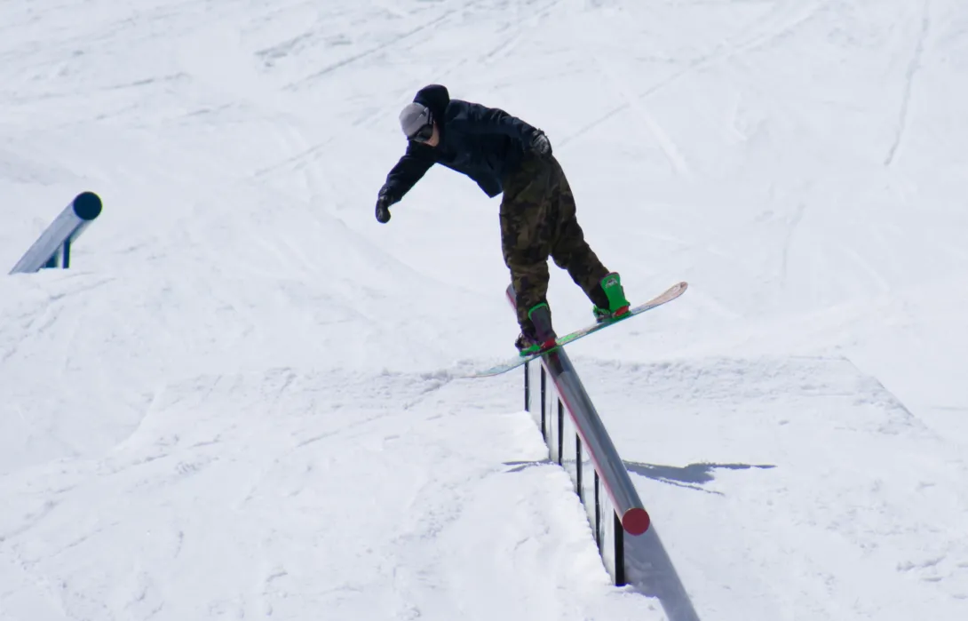 Snowboarder on rail