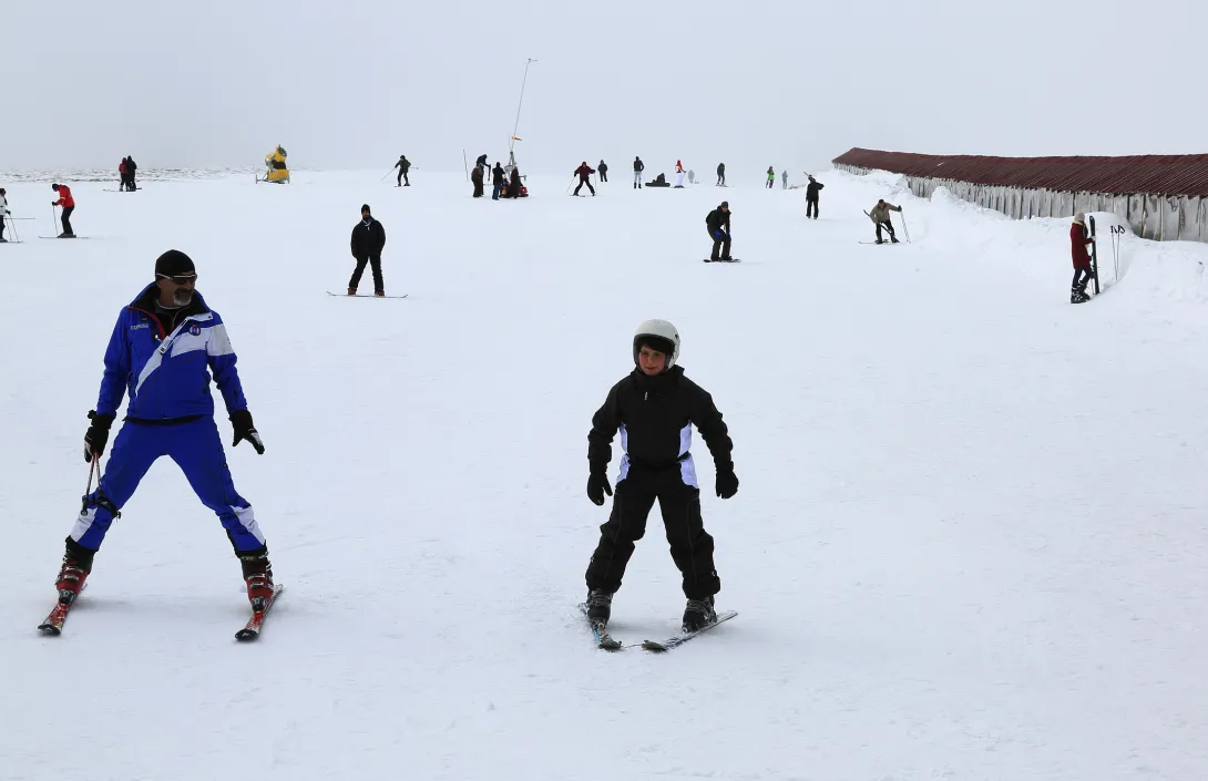 Ski instructor and student