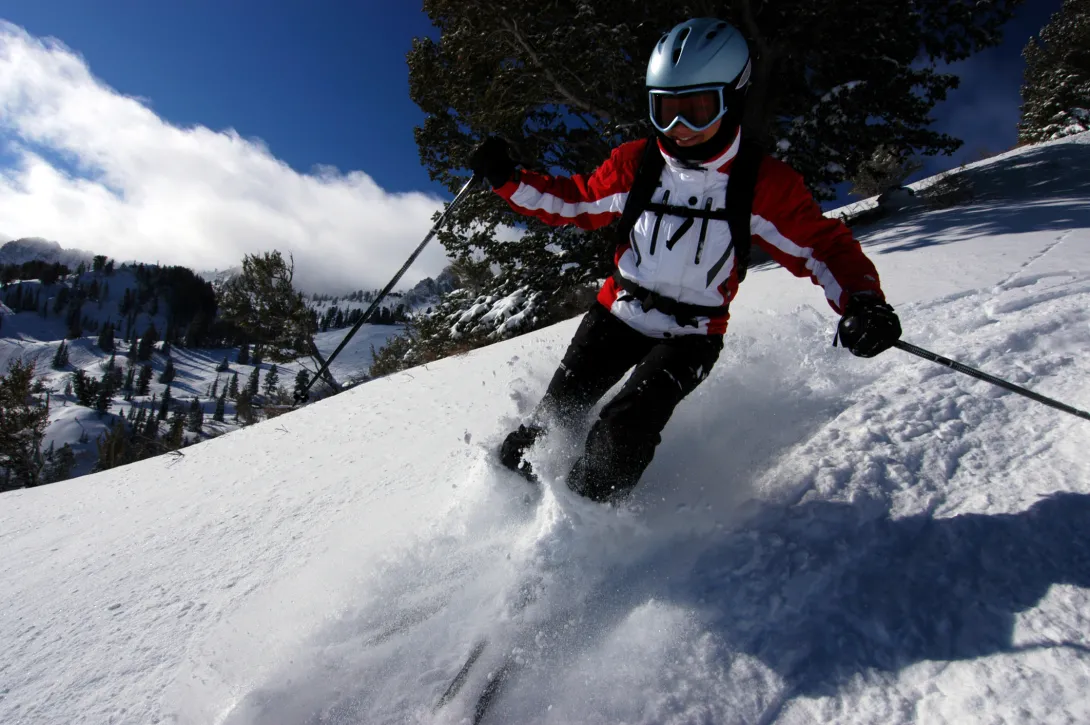 Woman skiing with fresh powder